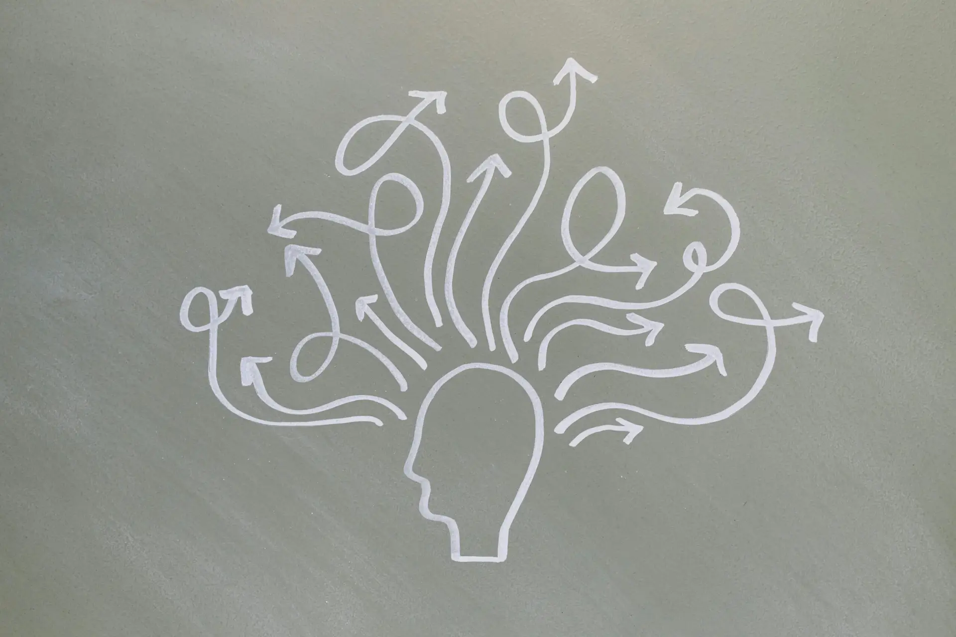 Conceptual chalk drawing illustrating mental health challenges with arrows representing thoughts.