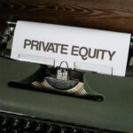 Close-up of a vintage typewriter with paper displaying 'Private Equity'.